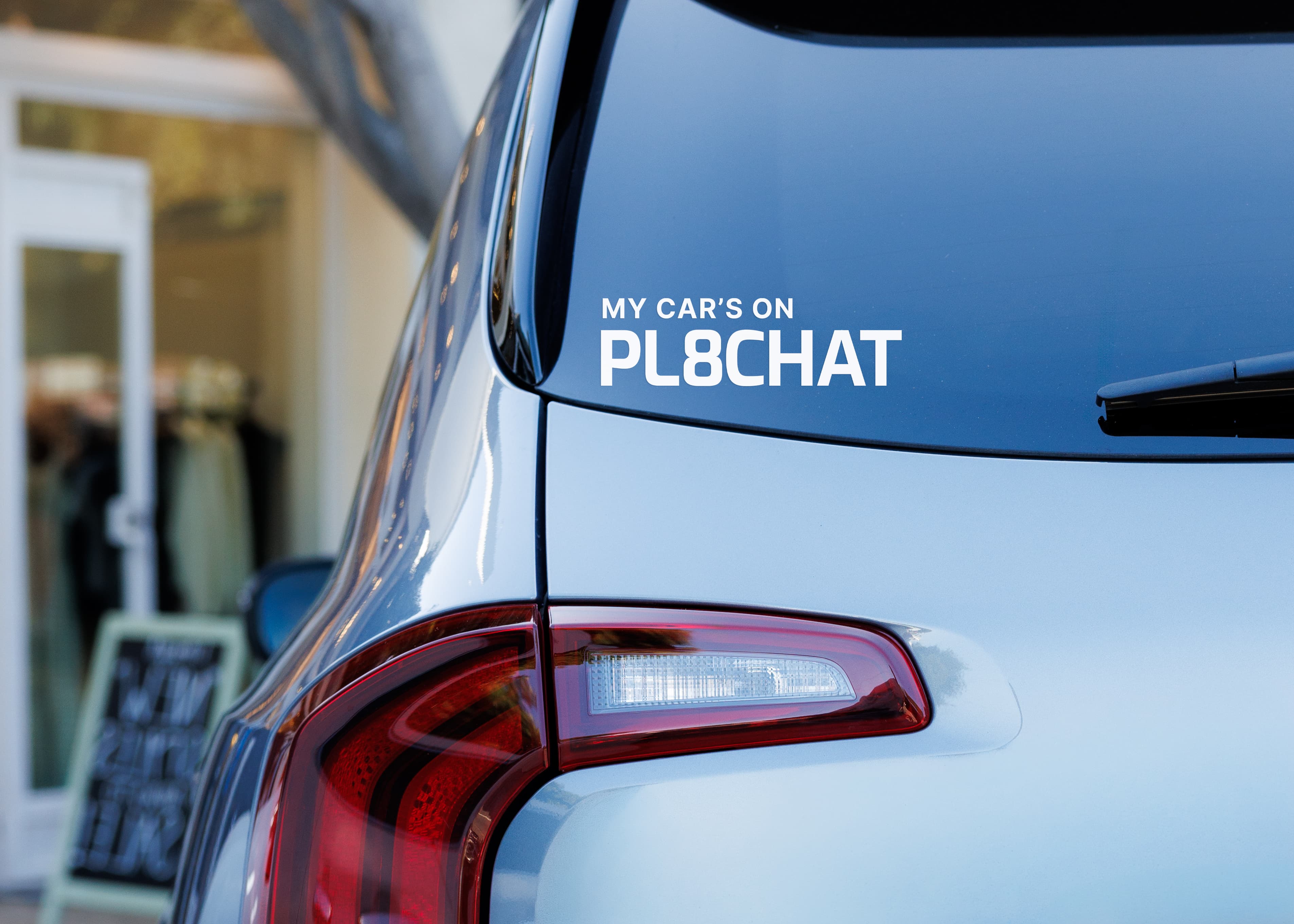 A driver standing next to a personal vehicle connected with PL8CHAT.