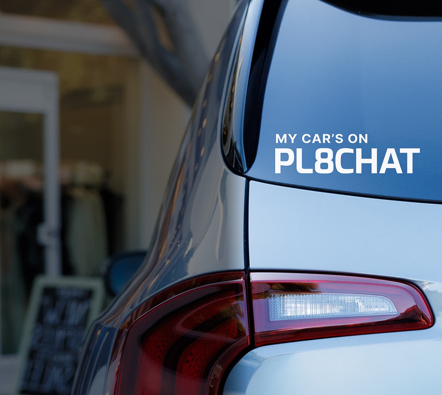 A driver standing next to a personal vehicle connected with PL8CHAT.