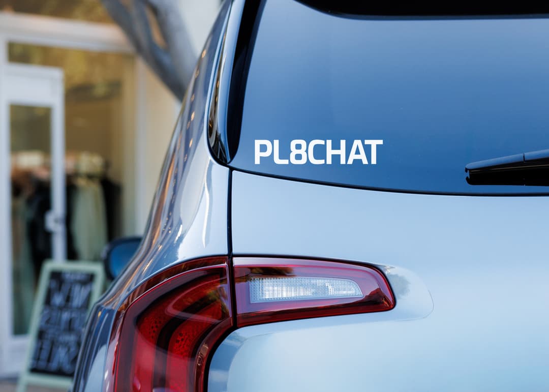 Car rear window with PL8CHAT connected decal sticker