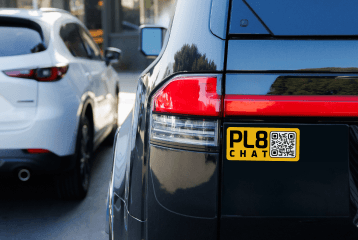Fleet truck rear showing Vehicle Connected on PL8CHAT sticker with California license plate